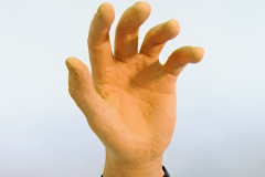 robotic animatronic hand with hyper realistic silicone skin with 13 degrees of freedom and internal servo mechanisms not shown but under a composite shiny black black sleek cover used for research and university projects