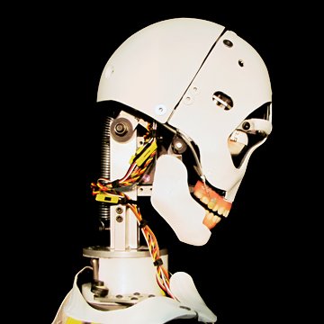 Custom white composite animatronic skull and shoulders—plasma-cut CNC parts, blue glowing eyes with eyelids, smooth machined finish by Custom Entertainment Solutions