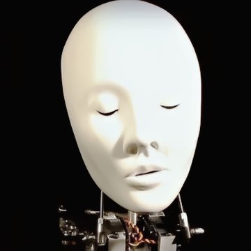A close-up of a female animatronic robot head featuring soft white silicone skin for lifelike facial texture, subtle human-like eyes and lips, mounted on an industrial-grade mechanical neck with visible bolts, servos, cables, and articulated metal components—designed for high-end film, television, and theater special effects