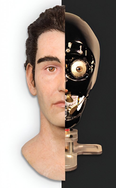 A close-up of a male android face crafted from soft silicone skin, displaying subtle human-like contours around eyes, nose, and mouth, with the back of the head and neck deliberately open to reveal intricate servos, cables, metal linkages, and precision motors—designed for realistic movement in entertainment robotics