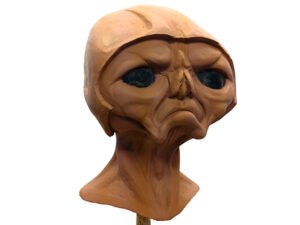 Detailed alien head sculpture sculpted in Chavant NSP clay, showing fine surface texture and professional animatronic sculpting work